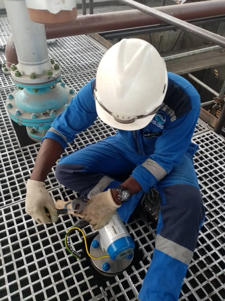 Technician verifying instrumentation during commissioning