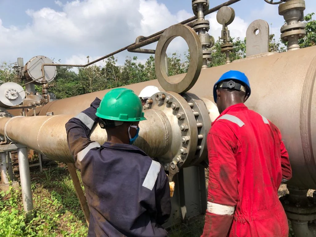 Technicians carrying out pipeline equipment maintenance